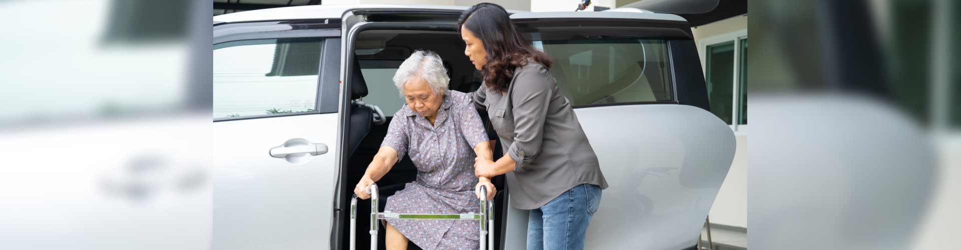 Woman patient sitting on walker prepare get to her car, healthy strong medical concept.